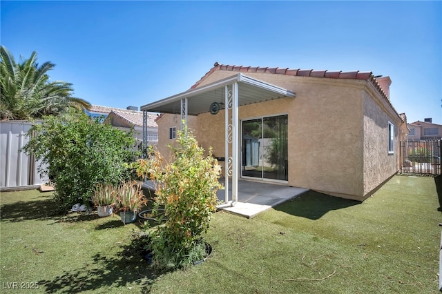 2165 Saint Paul Way, Las Vegas, NV 89104 - back of property with stucco siding and a patio