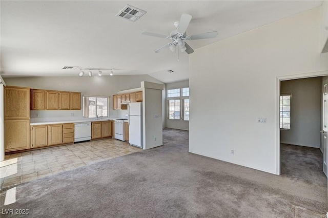 5917 Briar Rose Ln, Las Vegas, NV 89130 - kitchen with white appliances, lofted ceiling, light colored carpet, ceiling fan, and light countertops