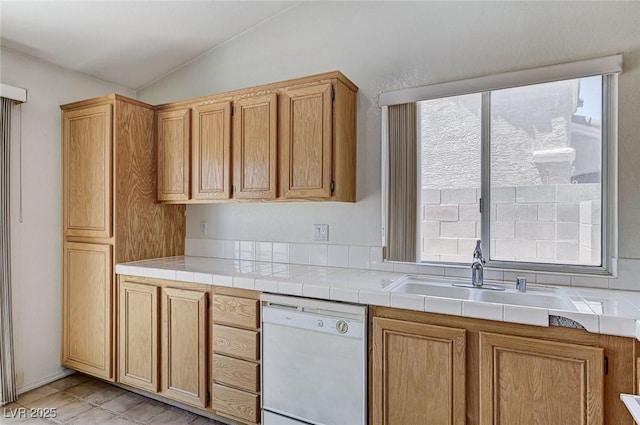 5917 Briar Rose Ln, Las Vegas, NV 89130 - kitchen with white dishwasher, vaulted ceiling, and light countertops