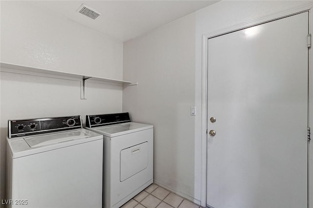 5917 Briar Rose Ln, Las Vegas, NV 89130 - laundry area featuring independent washer and dryer and light tile patterned flooring