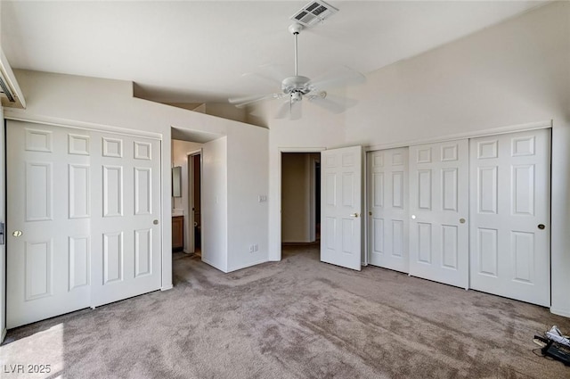 5917 Briar Rose Ln, Las Vegas, NV 89130 - unfurnished bedroom with carpet floors, multiple closets, lofted ceiling, and ceiling fan