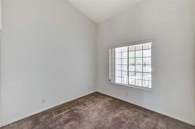 5917 Briar Rose Ln, Las Vegas, NV 89130 - spare room featuring dark colored carpet and vaulted ceiling