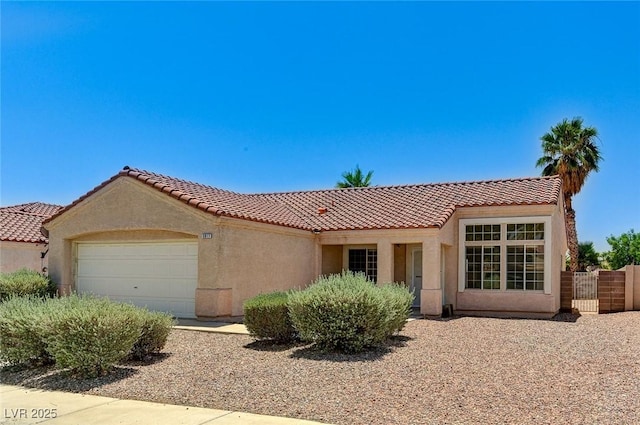5917 Briar Rose Ln, Las Vegas, NV 89130 - view of front facade with stucco siding, a tiled roof, and an attached garage