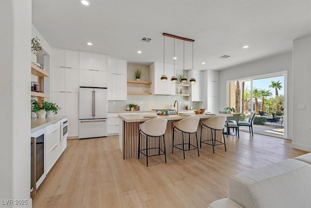 328 Hedgehope Dr, Las Vegas, NV 89183 - kitchen featuring open shelves, white appliances, modern cabinets, light countertops, and recessed lighting