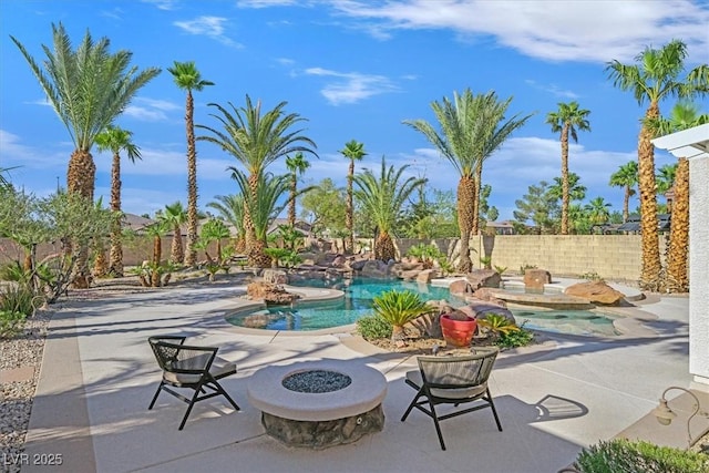328 Hedgehope Dr, Las Vegas, NV 89183 - view of swimming pool with an outdoor fire pit, a fenced backyard, and a patio area