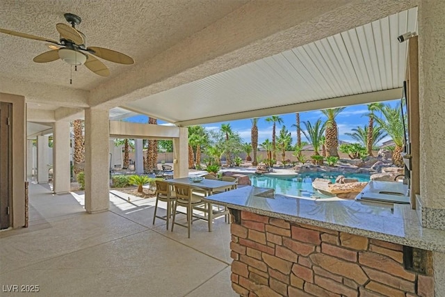 328 Hedgehope Dr, Las Vegas, NV 89183 - fenced backyard featuring a patio, ceiling fan, and an outdoor pool