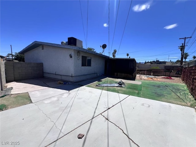 6120 Denver Cir, Las Vegas, NV 89107 - rear view of house with a patio area, a fenced backyard, and stucco siding