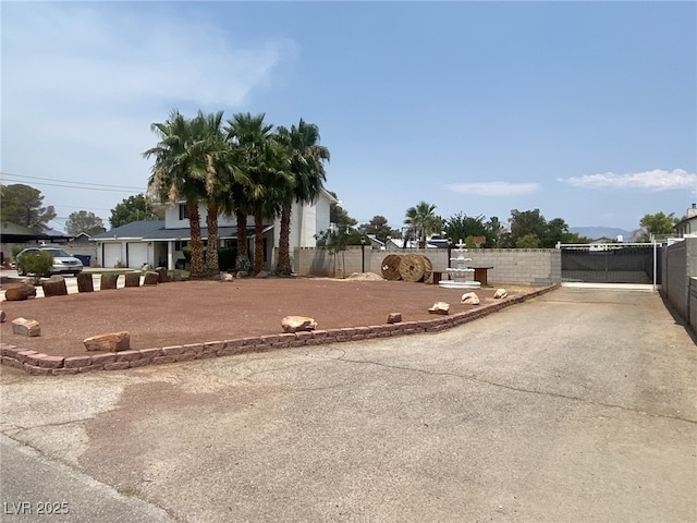 6140 Atwood Ave, Las Vegas, NV 89108 - view of front of house featuring driveway and a gate