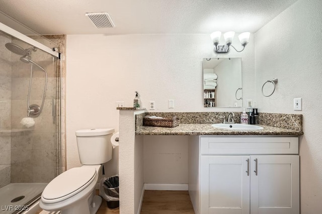 6140 Atwood Ave, Las Vegas, NV 89108 - full bathroom with a shower stall, vanity, and wood finished floors