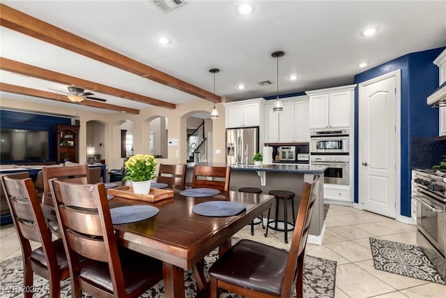 9380 Arrowhead Bluff Ave, Las Vegas, NV 89149 - dining room with arched walkways, recessed lighting, beam ceiling, a ceiling fan, and light tile patterned flooring