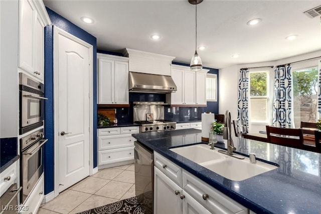 9380 Arrowhead Bluff Ave, Las Vegas, NV 89149 - kitchen featuring ventilation hood, stainless steel dishwasher, white cabinetry, hanging light fixtures, and recessed lighting