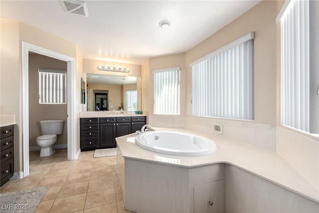 9380 Arrowhead Bluff Ave, Las Vegas, NV 89149 - bathroom with vanity, a bath, and tile patterned flooring