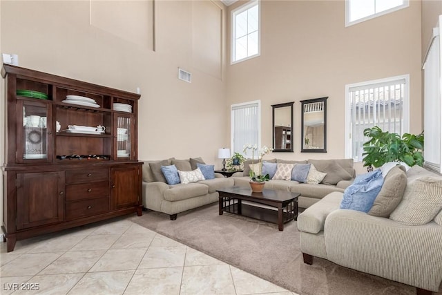 9380 Arrowhead Bluff Ave, Las Vegas, NV 89149 - living area featuring a high ceiling and healthy amount of natural light