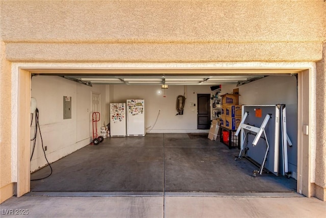 9380 Arrowhead Bluff Ave, Las Vegas, NV 89149 - garage featuring freestanding refrigerator and electric panel
