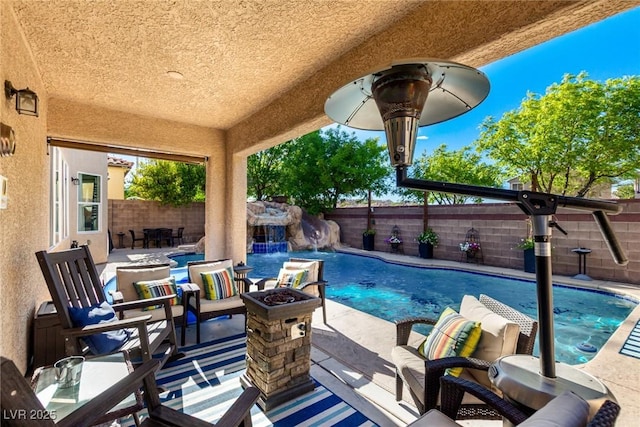 9380 Arrowhead Bluff Ave, Las Vegas, NV 89149 - view of pool with a fenced backyard, an outdoor fire pit, and a patio area
