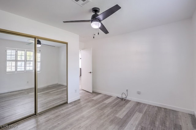 5320 Castle Harbor Ave, Las Vegas, NV 89130 - unfurnished bedroom featuring light wood-style flooring, a closet, and a ceiling fan