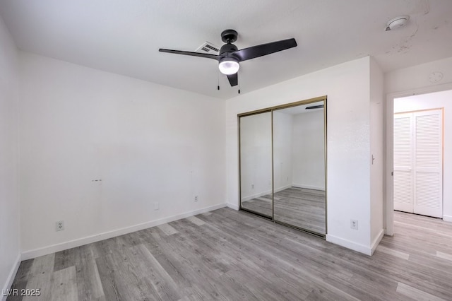 5320 Castle Harbor Ave, Las Vegas, NV 89130 - unfurnished bedroom featuring wood finished floors, a closet, and ceiling fan