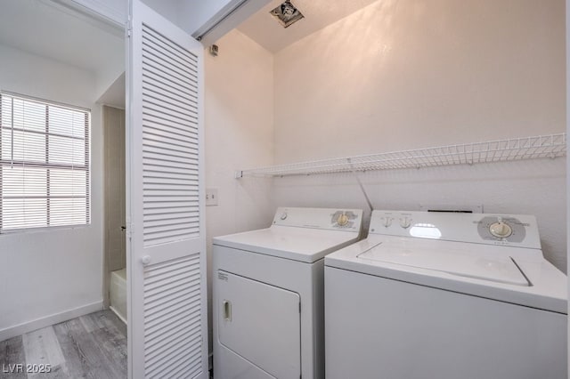 5320 Castle Harbor Ave, Las Vegas, NV 89130 - laundry room with separate washer and dryer and light wood-style flooring