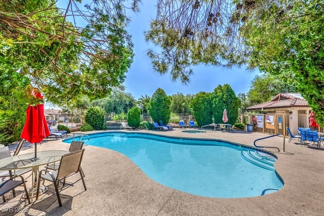 5320 Castle Harbor Ave, Las Vegas, NV 89130 - community pool with a patio and a community hot tub