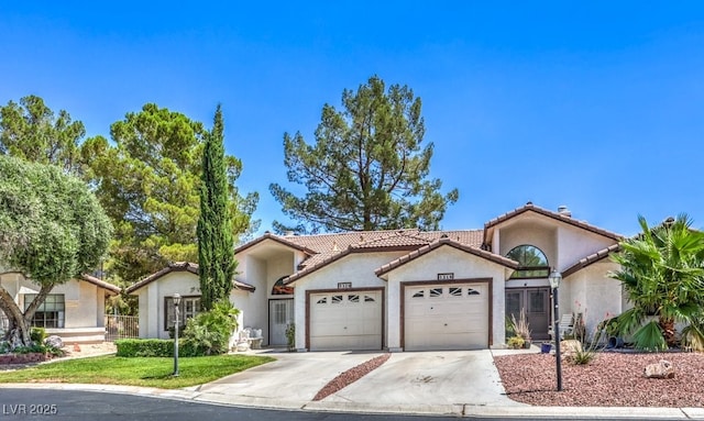 5320 Castle Harbor Ave, Las Vegas, NV 89130 - view of front facade featuring concrete driveway, an attached garage, stucco siding, and a tile roof
