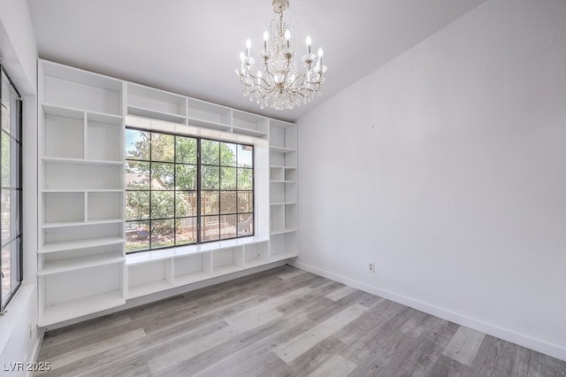 5320 Castle Harbor Ave, Las Vegas, NV 89130 - unfurnished room featuring wood finished floors and a chandelier