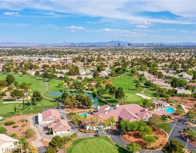 5320 Castle Harbor Ave, Las Vegas, NV 89130 - aerial view of residential area featuring a golf course and a water and mountain view