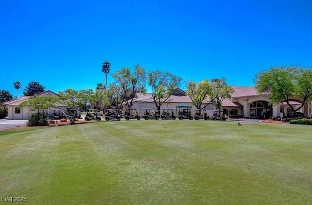 5320 Castle Harbor Ave, Las Vegas, NV 89130 - view of yard with an area to practice putting