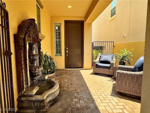 2132 Solvang Mill Dr, Las Vegas, NV 89135 - doorway to property featuring a patio and stucco siding
