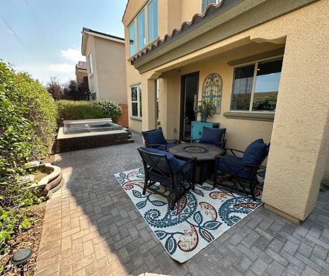 2132 Solvang Mill Dr, Las Vegas, NV 89135 - view of patio / terrace featuring an outdoor fire pit