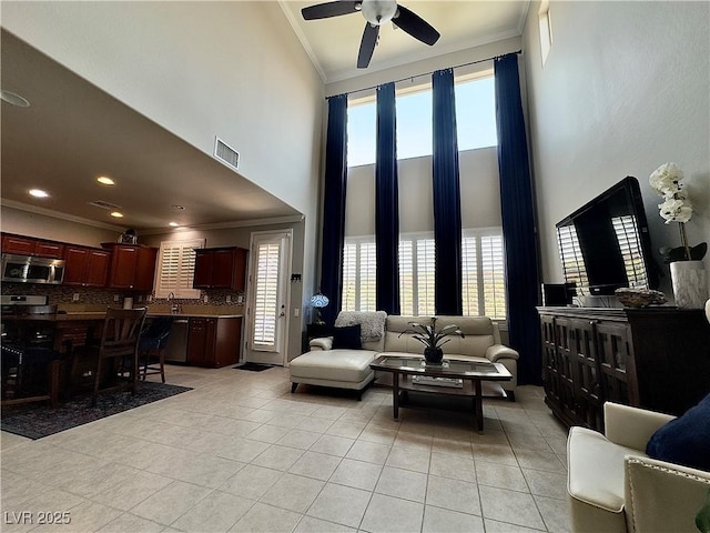 2132 Solvang Mill Dr, Las Vegas, NV 89135 - living area featuring crown molding, high vaulted ceiling, a ceiling fan, and light tile patterned floors