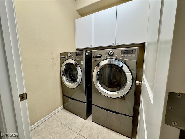 2132 Solvang Mill Dr, Las Vegas, NV 89135 - washroom featuring cabinet space, separate washer and dryer, and light tile patterned flooring