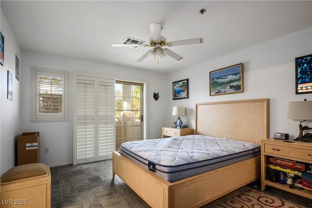 1809 Cutlass Dr Unit 0, Henderson, NV 89014 - bedroom featuring access to exterior, stone finish floors, and a ceiling fan
