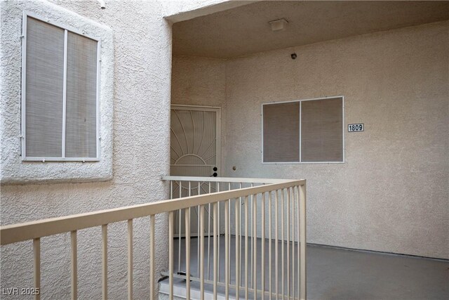 1809 Cutlass Dr Unit 0, Henderson, NV 89014 - view of exterior entry featuring stucco siding and a balcony