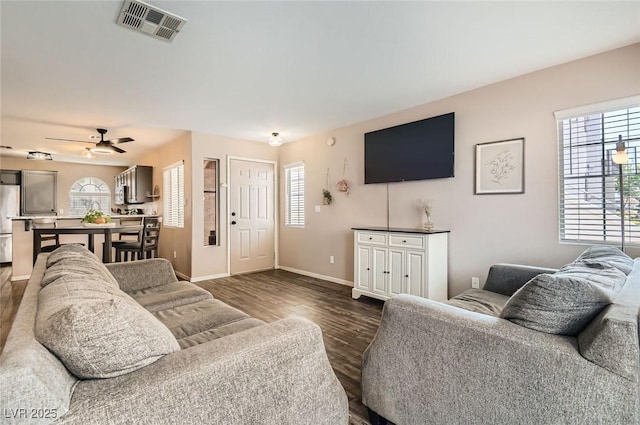3125 N Buffalo Dr Unit 1090, Las Vegas, NV 89128 - living area featuring healthy amount of natural light, ceiling fan, and dark wood finished floors