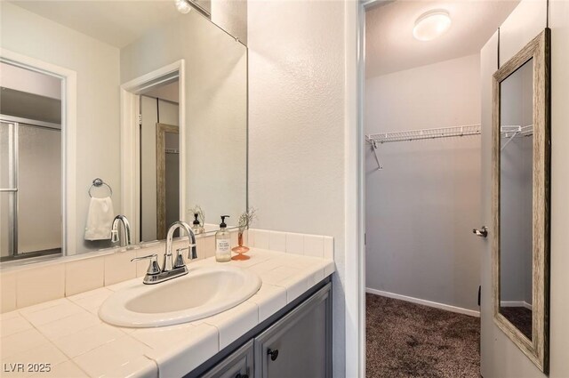 3125 N Buffalo Dr Unit 1090, Las Vegas, NV 89128 - full bathroom featuring vanity and a spacious closet