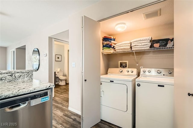 3125 N Buffalo Dr Unit 1090, Las Vegas, NV 89128 - washroom featuring dark wood finished floors and washer and dryer