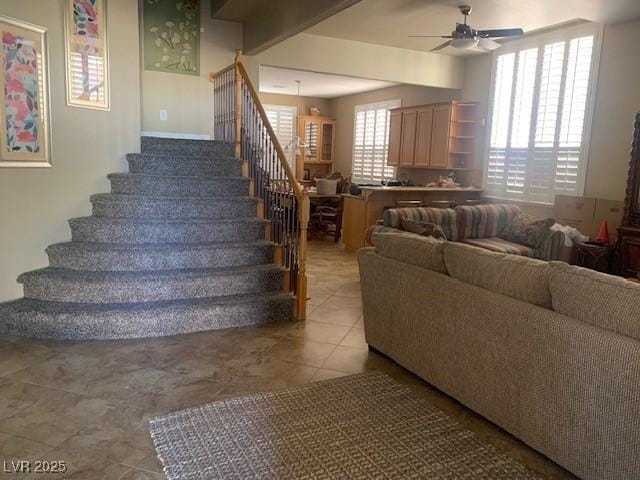 302 Doe Run, Henderson, NV 89012 - tiled living area featuring stairway and a ceiling fan