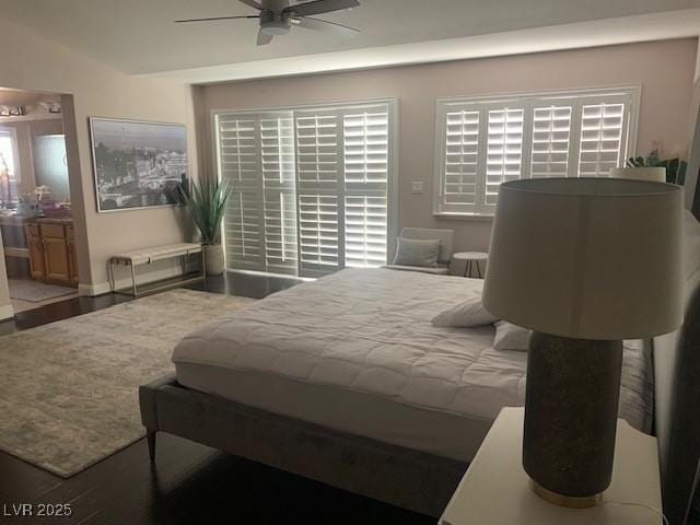 302 Doe Run, Henderson, NV 89012 - bedroom featuring wood finished floors, connected bathroom, and ceiling fan