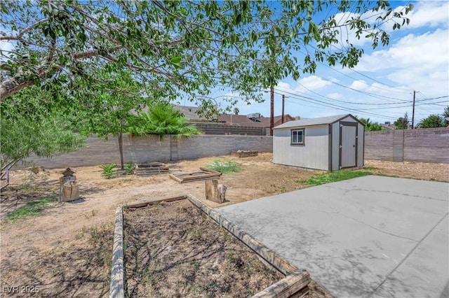 1317 Pyramid Dr, Las Vegas, NV 89108 - fenced backyard featuring a garden, a patio, and a storage shed