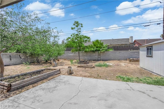 1317 Pyramid Dr, Las Vegas, NV 89108 - fenced backyard featuring a garden and a patio area