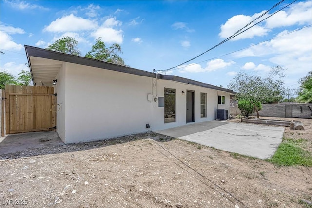 1317 Pyramid Dr, Las Vegas, NV 89108 - rear view of house featuring stucco siding and a patio