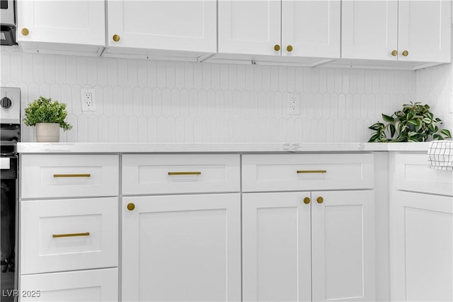 1317 Pyramid Dr, Las Vegas, NV 89108 - kitchen with light countertops and white cabinetry