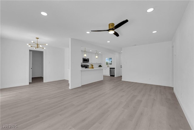 1317 Pyramid Dr, Las Vegas, NV 89108 - unfurnished living room with a chandelier, light wood finished floors, recessed lighting, and ceiling fan