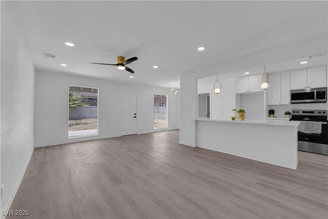 1317 Pyramid Dr, Las Vegas, NV 89108 - unfurnished living room featuring light wood-style floors, recessed lighting, and ceiling fan