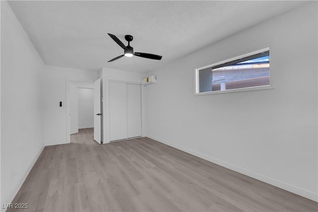 1317 Pyramid Dr, Las Vegas, NV 89108 - unfurnished bedroom with wood finished floors, a closet, ceiling fan, and a textured ceiling