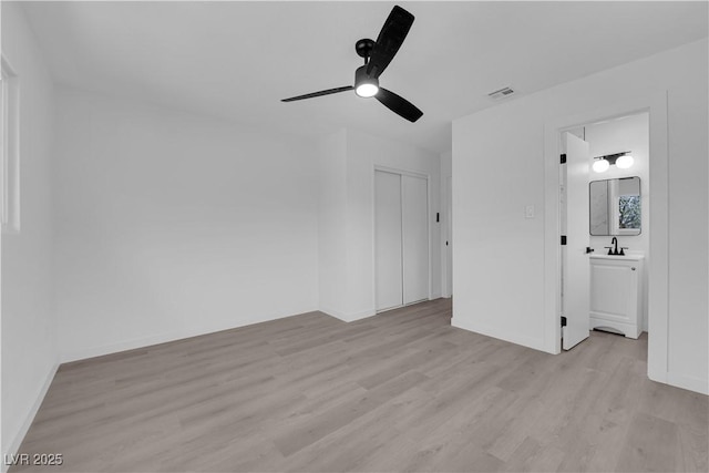 1317 Pyramid Dr, Las Vegas, NV 89108 - unfurnished bedroom with light wood-style flooring, a closet, and ceiling fan