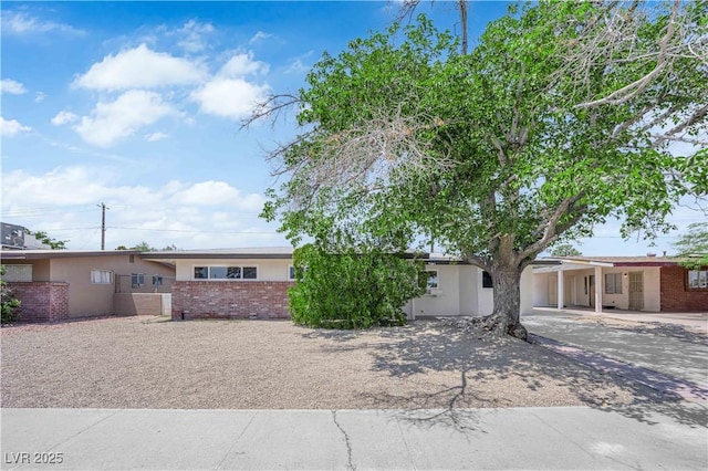 1317 Pyramid Dr, Las Vegas, NV 89108 - single story home with brick siding, stucco siding, and driveway