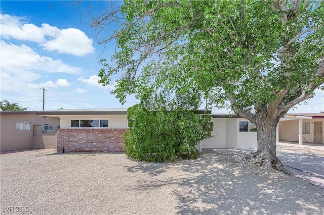 1317 Pyramid Dr, Las Vegas, NV 89108 - view of front of property with brick siding and stucco siding