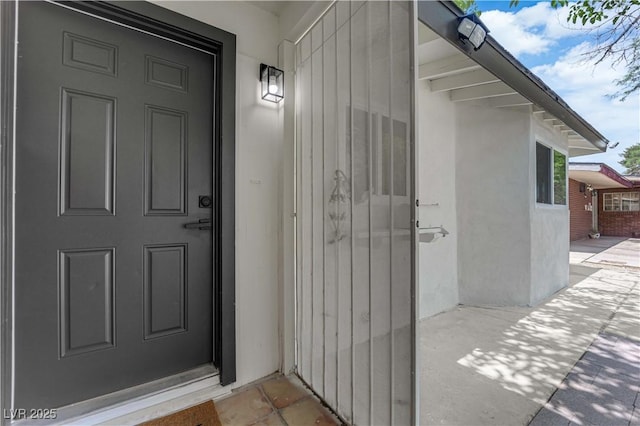 1317 Pyramid Dr, Las Vegas, NV 89108 - doorway to property featuring stucco siding