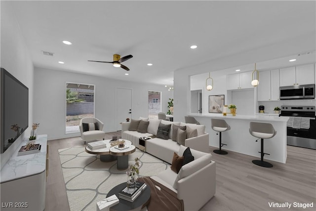 1317 Pyramid Dr, Las Vegas, NV 89108 - living area featuring light wood-style floors, recessed lighting, and a ceiling fan